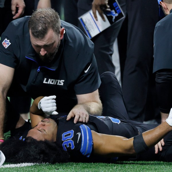 Trainers check on Detroit Lions cornerback Khalil Dorsey (30) during the first half of an NFL football game against the Buffalo Bills, Sunday, Dec. 15, 2024, in Detroit. (AP Photo/Duane Burleson)