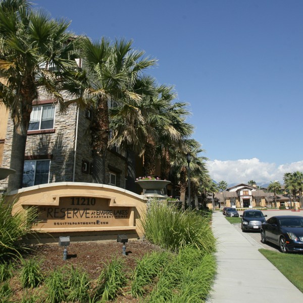 Federal agents raided about 20 locations, related to a birth tourism scheme, in three Southern California counties, including this apartment complex in Rancho Cucamonga, Calif., Tuesday, March 3, 2015. (Stan Lim/The Press-Enterprise via AP)