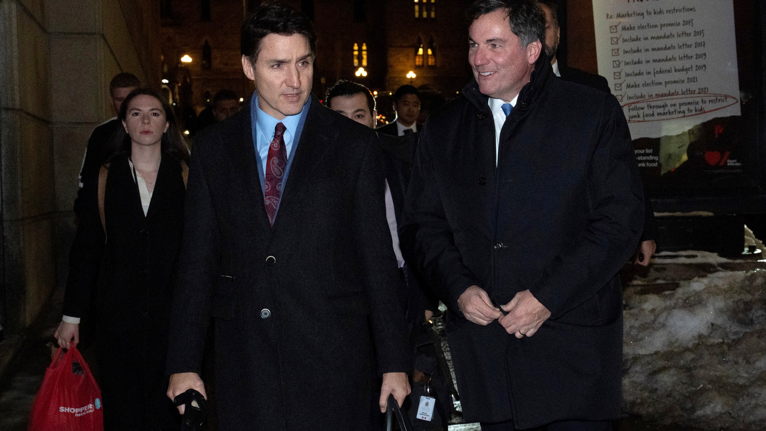 Canada's Prime Minister Justin Trudeau makes his way way his new Finance Minister, Dominic LeBlanc to a national caucus meeting, in Ottawa, Ontario, Monday, Dec. 16, 2024. (Adrian Wyld/The Canadian Press via AP)