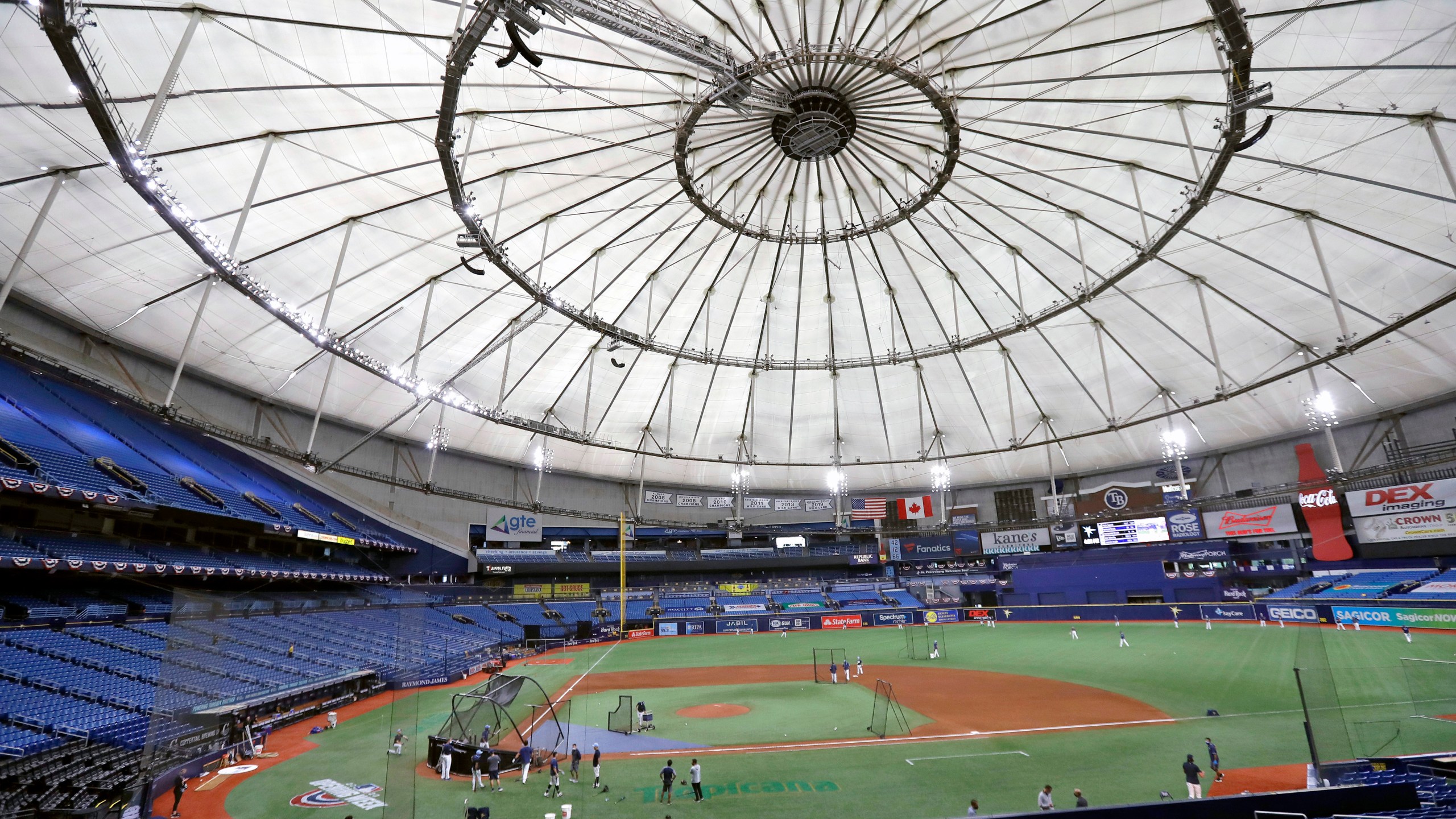 FILE - Members of the Tampa Bay Rays take batting practice at Tropicana Field before a baseball game against the Toronto Blue Jays, July 24, 2020, in St. Petersburg, Fla.. (AP Photo/Chris O'Meara, File)