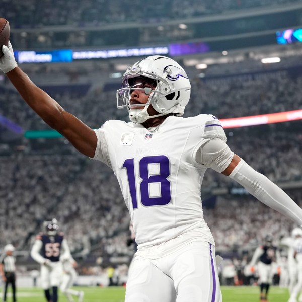 Minnesota Vikings wide receiver Justin Jefferson celebrates after catching a 7-yard touchdown pass during the first half of an NFL football game against the Chicago Bears, Monday, Dec. 16, 2024, in Minneapolis. (AP Photo/Abbie Parr)