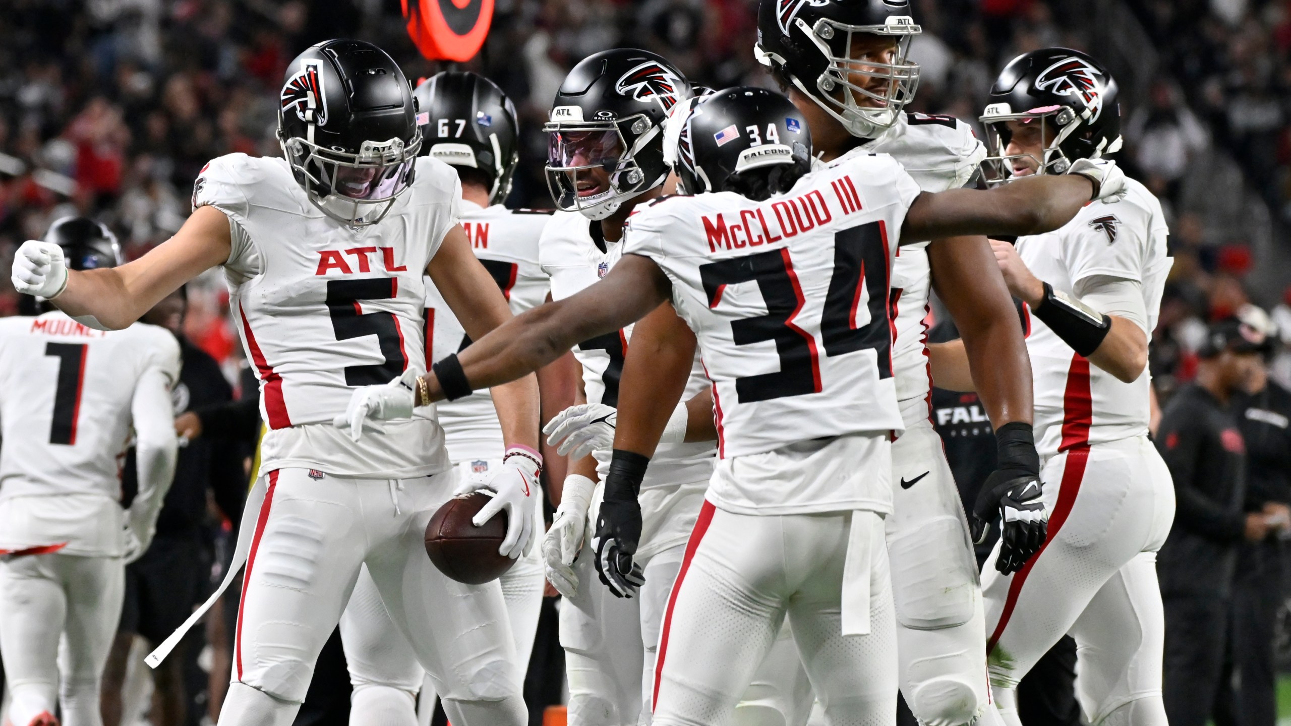 Atlanta Falcons wide receiver Drake London (5) celebrates his touchdown against the Las Vegas Raiders with teammates during the first half of an NFL football game, Monday, Dec. 16, 2024, in Las Vegas. (AP Photo/David Becker)