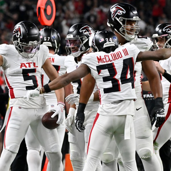 Atlanta Falcons wide receiver Drake London (5) celebrates his touchdown against the Las Vegas Raiders with teammates during the first half of an NFL football game, Monday, Dec. 16, 2024, in Las Vegas. (AP Photo/David Becker)