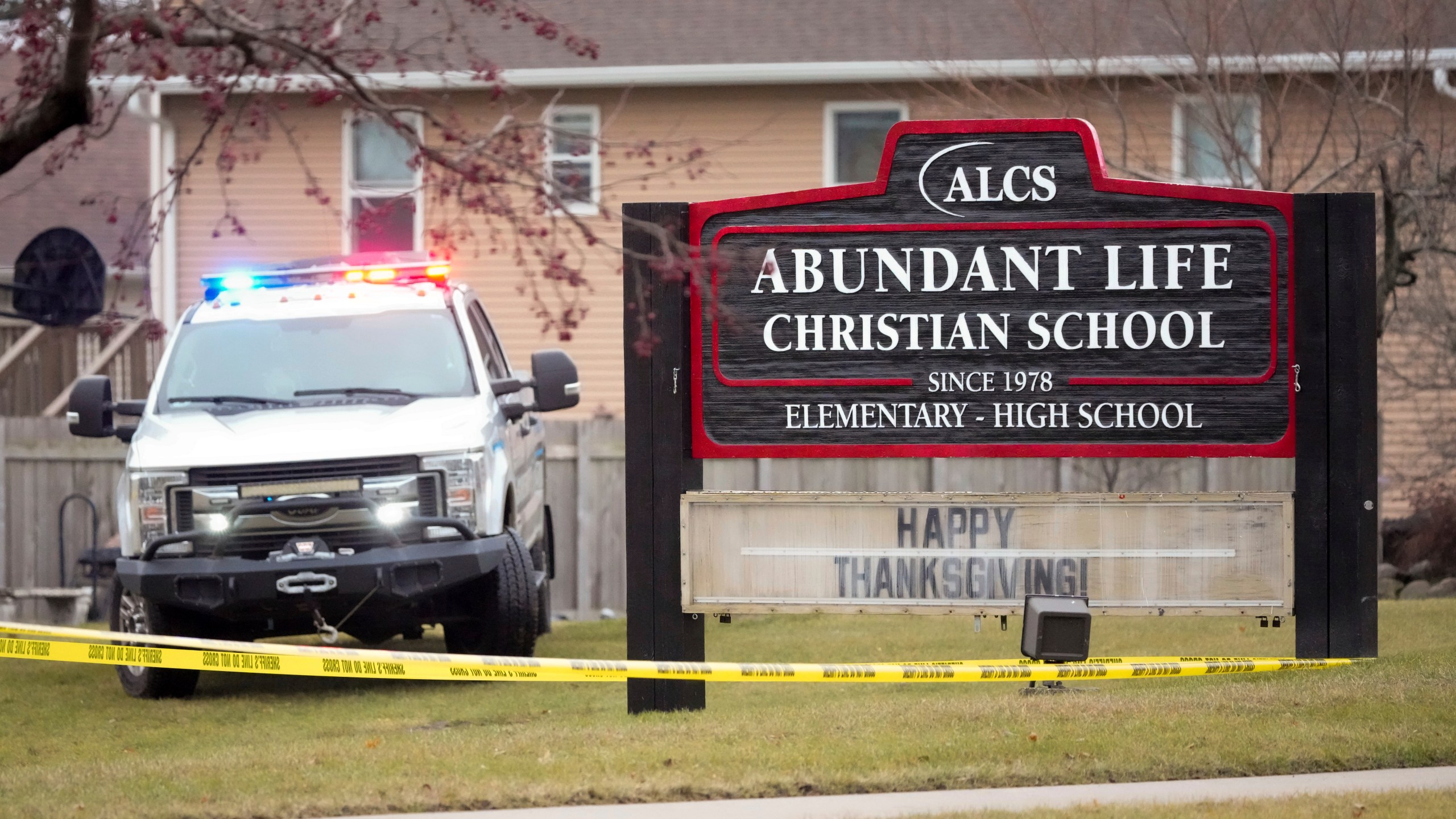 Emergency vehicles are parked outside the Abundant Life Christian School in Madison, Wis., following a shooting, Monday, Dec. 16, 2024. (AP Photo/Morry Gash)