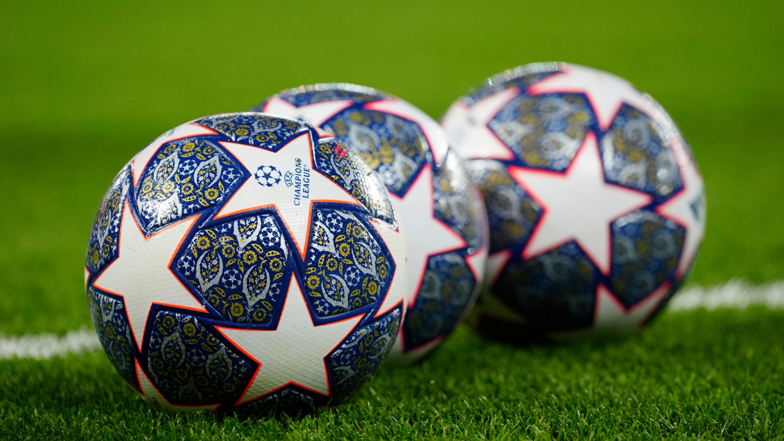 The Official UEFA Champions League match balls lie on the pitch ahead of the Champions League, round of 16, first leg soccer match between Liverpool and Real Madrid at the Anfield stadium in Liverpool, England, on Feb. 21, 2023. (AP Photo/Jon Super, File)