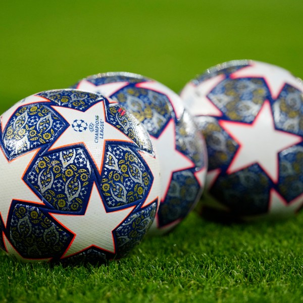 The Official UEFA Champions League match balls lie on the pitch ahead of the Champions League, round of 16, first leg soccer match between Liverpool and Real Madrid at the Anfield stadium in Liverpool, England, on Feb. 21, 2023. (AP Photo/Jon Super, File)