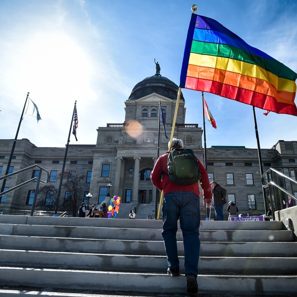 FILE - Demonstrators gather on the steps of the Montana state Capitol protesting anti-LGBTQ+ legislation in Helena, Mont., March 15, 2021. (Thom Bridge/Independent Record via AP, File)