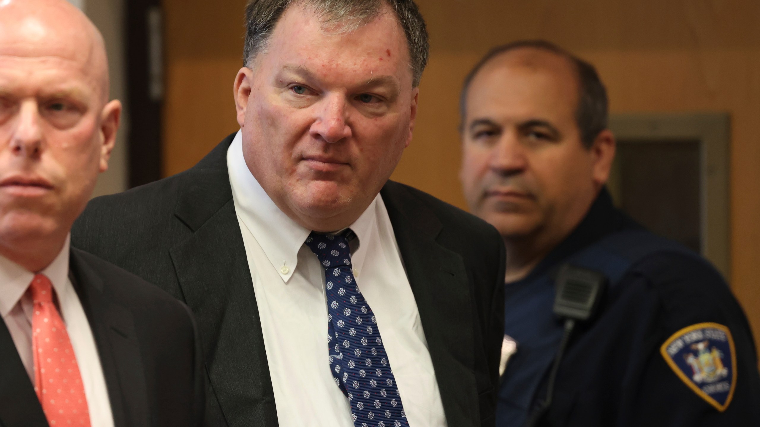 FILE - Rex Heuermann, center, charged in the Gilgo Beach serial killings on Long Island, appears for a hearing, Tuesday, July 30, 2024, at Suffolk County Court in Riverhead, N.Y. (James Carbone/Newsday via AP, File, Pool)