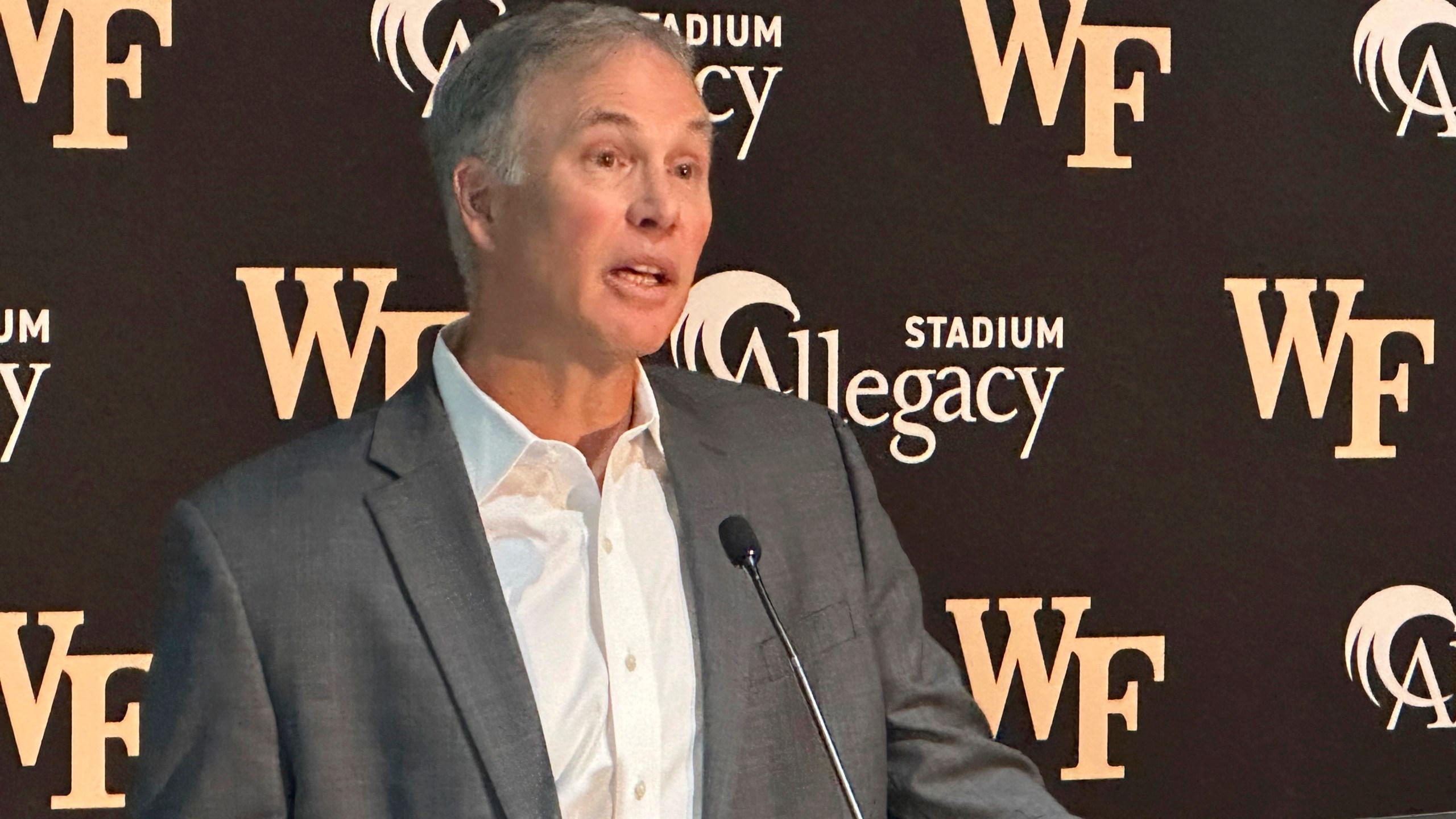 Dave Clawson explaining his decision to resign as head football coach at Wake Forest, Tuesday, Dec. 17, 2024, during an during an NCAA college football news conference in Winston-Salem, N.C. (AP Photo/Aaron Beard)