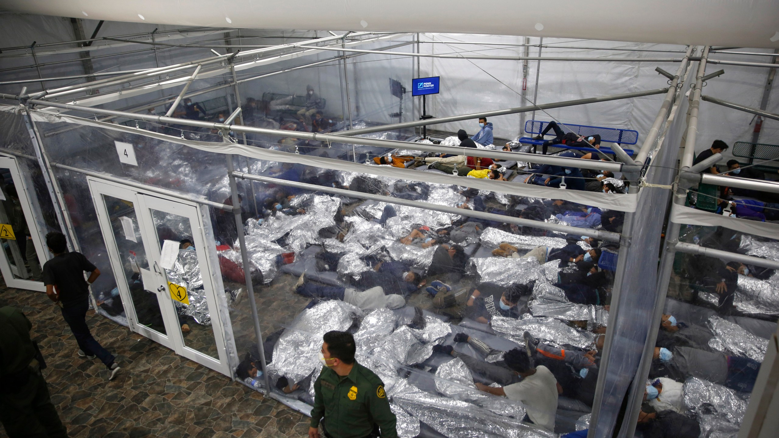 FILE - In this March 30, 2021, file photo, young minors lie inside a pod at the Donna Department of Homeland Security holding facility, the main detention center for unaccompanied children in the Rio Grande Valley run by U.S. Customs and Border Protection (CBP), in Donna, Texas. (AP Photo/Dario Lopez-Mills, Pool, File)