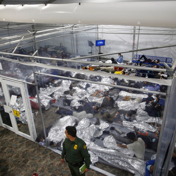 FILE - In this March 30, 2021, file photo, young minors lie inside a pod at the Donna Department of Homeland Security holding facility, the main detention center for unaccompanied children in the Rio Grande Valley run by U.S. Customs and Border Protection (CBP), in Donna, Texas. (AP Photo/Dario Lopez-Mills, Pool, File)