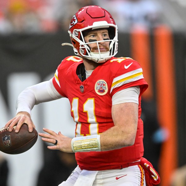 Kansas City Chiefs quarterback Carson Wentz (11) passes in the pocket against the Cleveland Browns during the second half of an NFL football game, Sunday, Dec. 15, 2024, in Cleveland. (AP Photo/David Richard)