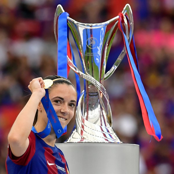 FILE - Barcelona's Aitana Bonmati holding up her medal walks past the trophy after winning the women's Champions League final soccer match between FC Barcelona and Olympique Lyonnais at the San Mames stadium in Bilbao, Spain, Saturday, May 25, 2024. (AP Photo/Alvaro Barrientos, FIle)