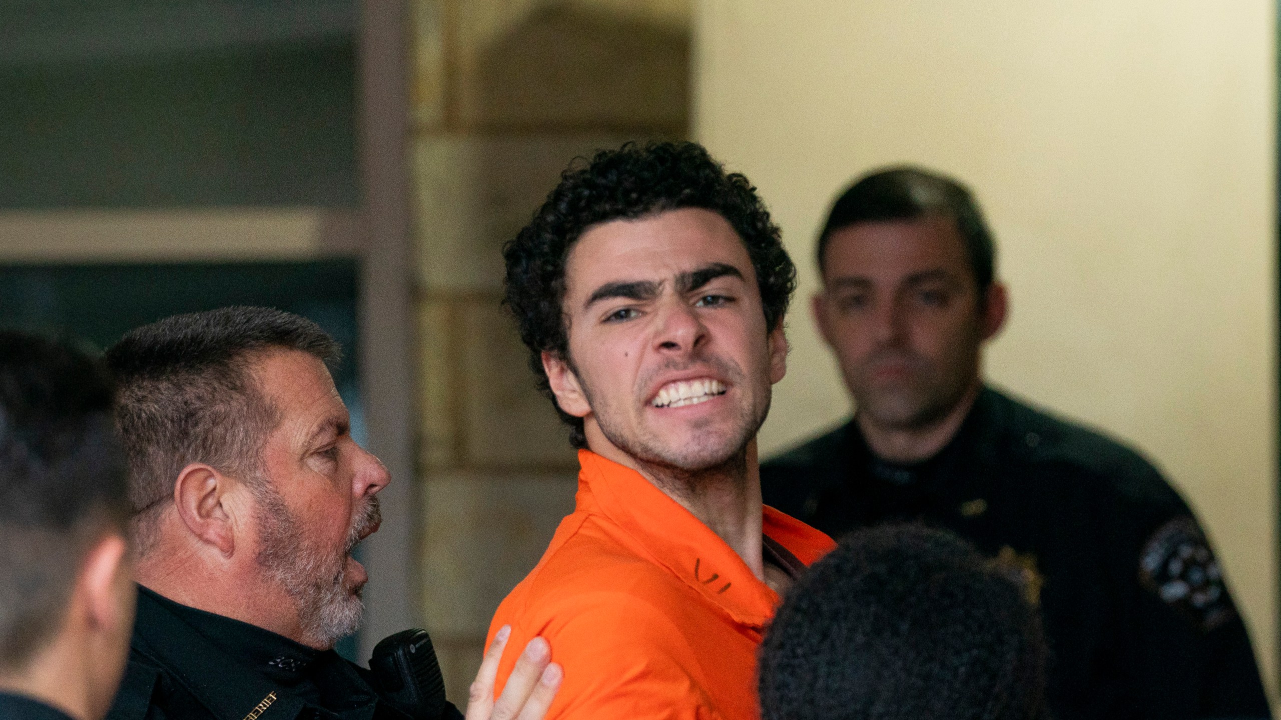 Suspect Luigi Mangione is taken into the Blair County Courthouse on Tuesday, Dec. 10, 2024, in Hollidaysburg, Pa. (Benjamin B. Braun/Pittsburgh Post-Gazette via AP)