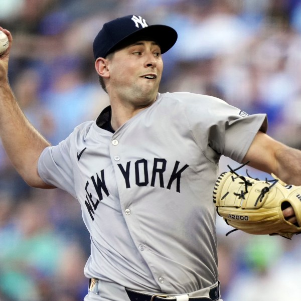 FILE - New York Yankees starting pitcher Cody Poteet throws during the first inning of a baseball game against the Kansas City Royals Wednesday, June 12, 2024, in Kansas City, Mo. (AP Photo/Charlie Riedel, File)