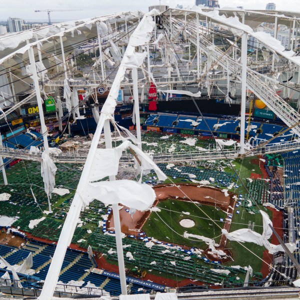 FILE - The roof of the Tropicana Field is damaged the morning after Hurricane Milton hit the region, Oct. 10, 2024, in St. Petersburg, Fla. (AP Photo/Julio Cortez, File)