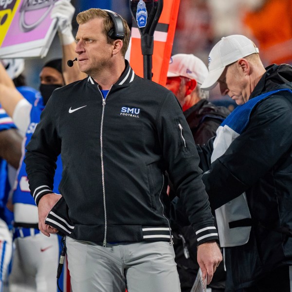 SMU head coach Rhett Lashlee looks on in the first half of the Atlantic Coast Conference championship NCAA college football game against Clemson, Saturday, Dec. 7, 2024, in Charlotte, N.C. (AP Photo/Jacob Kupferman)