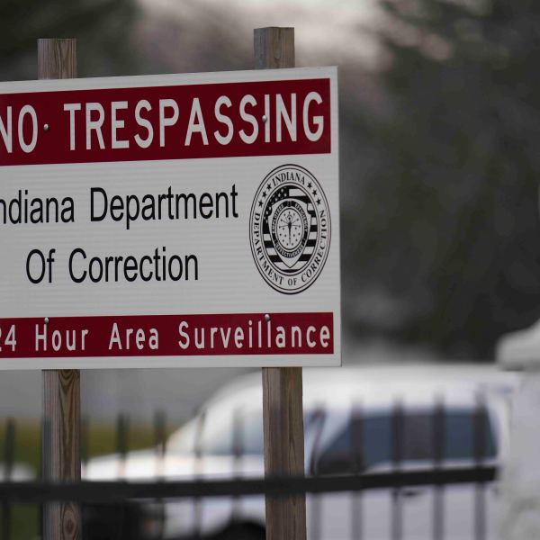 A sign is posted outside of Indiana State Prison where, barring last-minute court action or intervention by Gov. Eric Holcomb, Joseph Corcoran, 49, convicted in the 1997 killings of his brother and three other people, is scheduled to be put to death by lethal injection before sunrise Tuesday, Dec. 17, 2024, in Michigan City, Ind. (AP Photo/Erin Hooley)