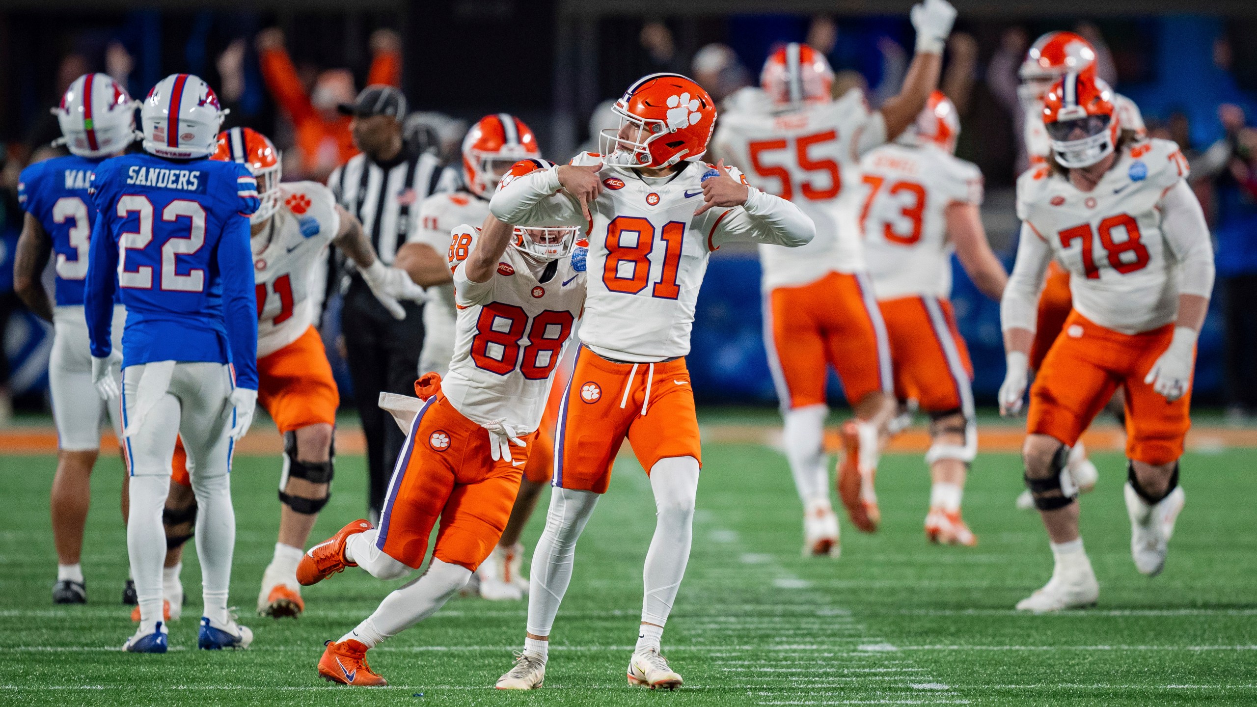 FILE - Clemson place kicker Nolan Hauser (81) reacts after kicking the game winning field goal in the Atlantic Coast Conference championship NCAA college football game against SMU Saturday, Dec. 7, 2024, in Charlotte, N.C. (AP Photo/Jacob Kupferman, FIle)