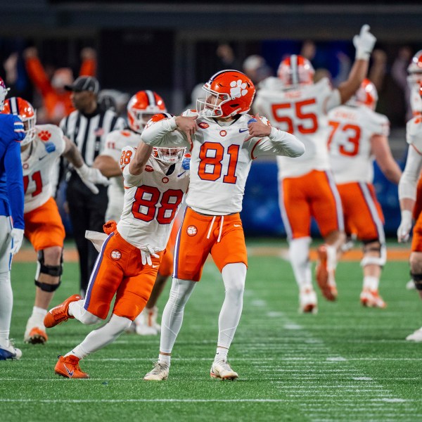 FILE - Clemson place kicker Nolan Hauser (81) reacts after kicking the game winning field goal in the Atlantic Coast Conference championship NCAA college football game against SMU Saturday, Dec. 7, 2024, in Charlotte, N.C. (AP Photo/Jacob Kupferman, FIle)