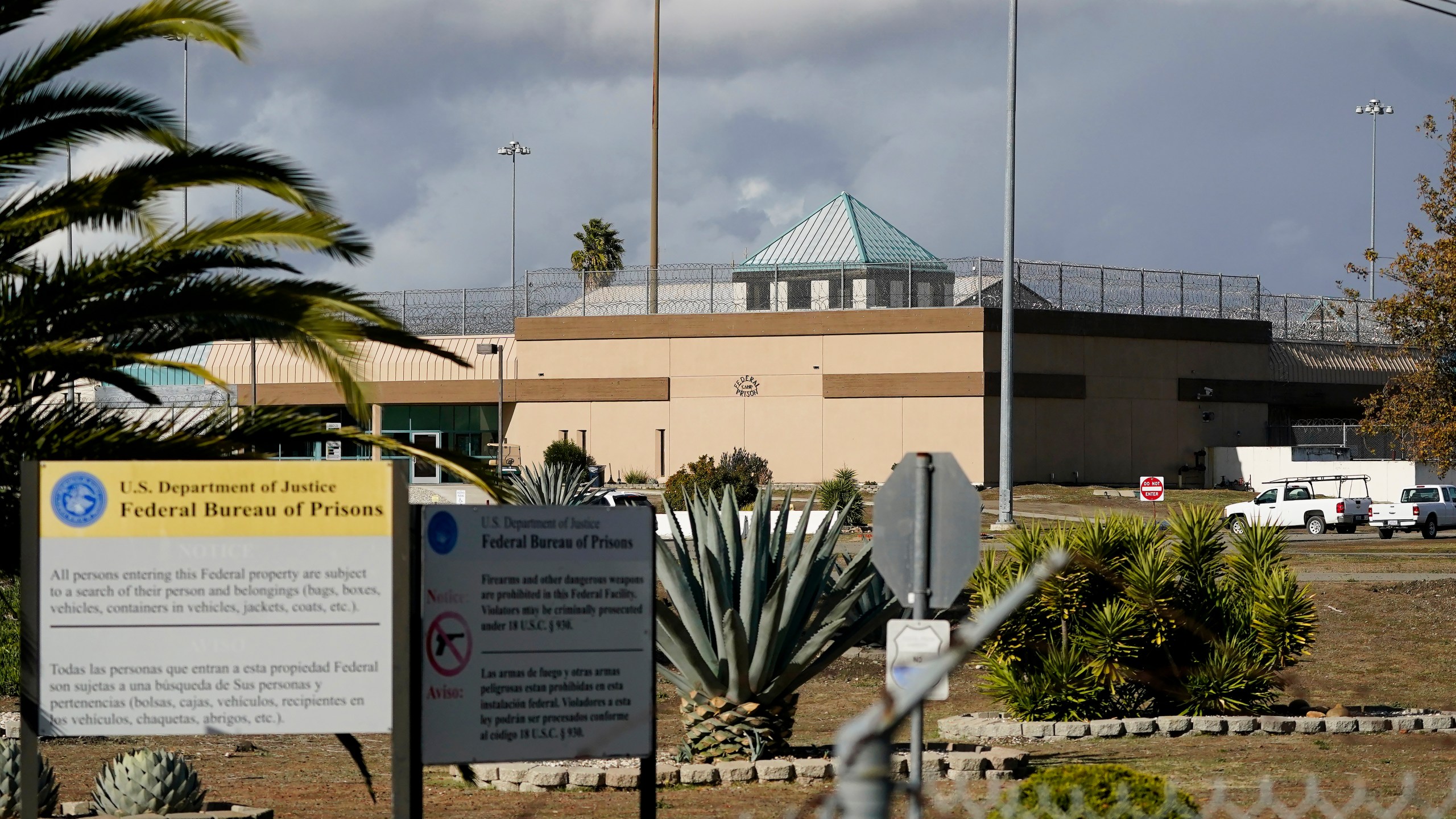 FILE - The Federal Correctional Institution stands in Dublin, Calif., Dec. 5, 2022. The U.S. government will pay nearly $116 million to resolve lawsuits brought by more than 100 women who say they were abused or mistreated at a now-shuttered federal prison in California that was known as the “rape club” because of rampant staff-on-inmate sexual misconduct. (AP Photo/Jeff Chiu, File)