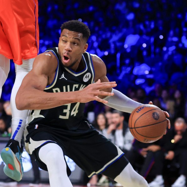 Milwaukee Bucks forward Giannis Antetokounmpo (34) drives against Oklahoma City Thunder center Isaiah Hartenstein (55) during the second half of the championship game in the NBA Cup basketball tournament Tuesday, Dec. 17, 2024, in Las Vegas. (AP Photo/Ian Maule)