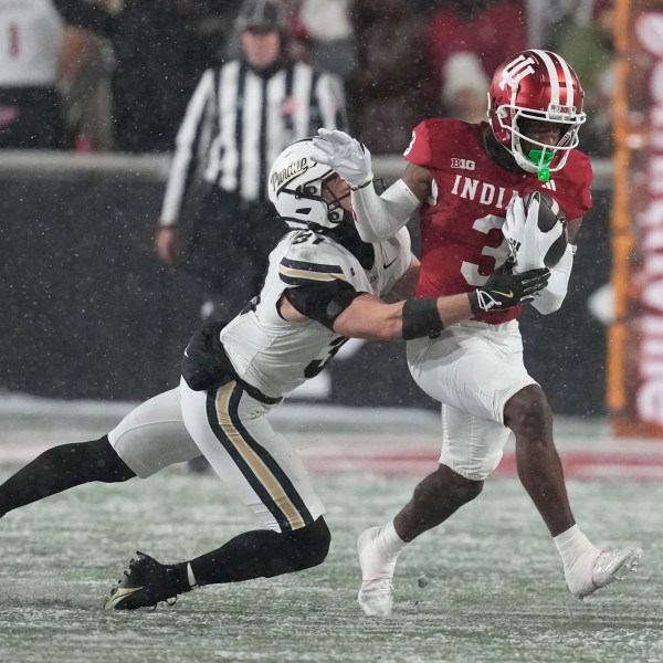 FILE - Indiana wide receiver Omar Cooper Jr. (3) is tackled by Purdue defensive back Dillon Thieneman (31) during the first half of an NCAA college football game, Saturday, Nov. 30, 2024, in Bloomington, Ind. (AP Photo/Darron Cummings, File)