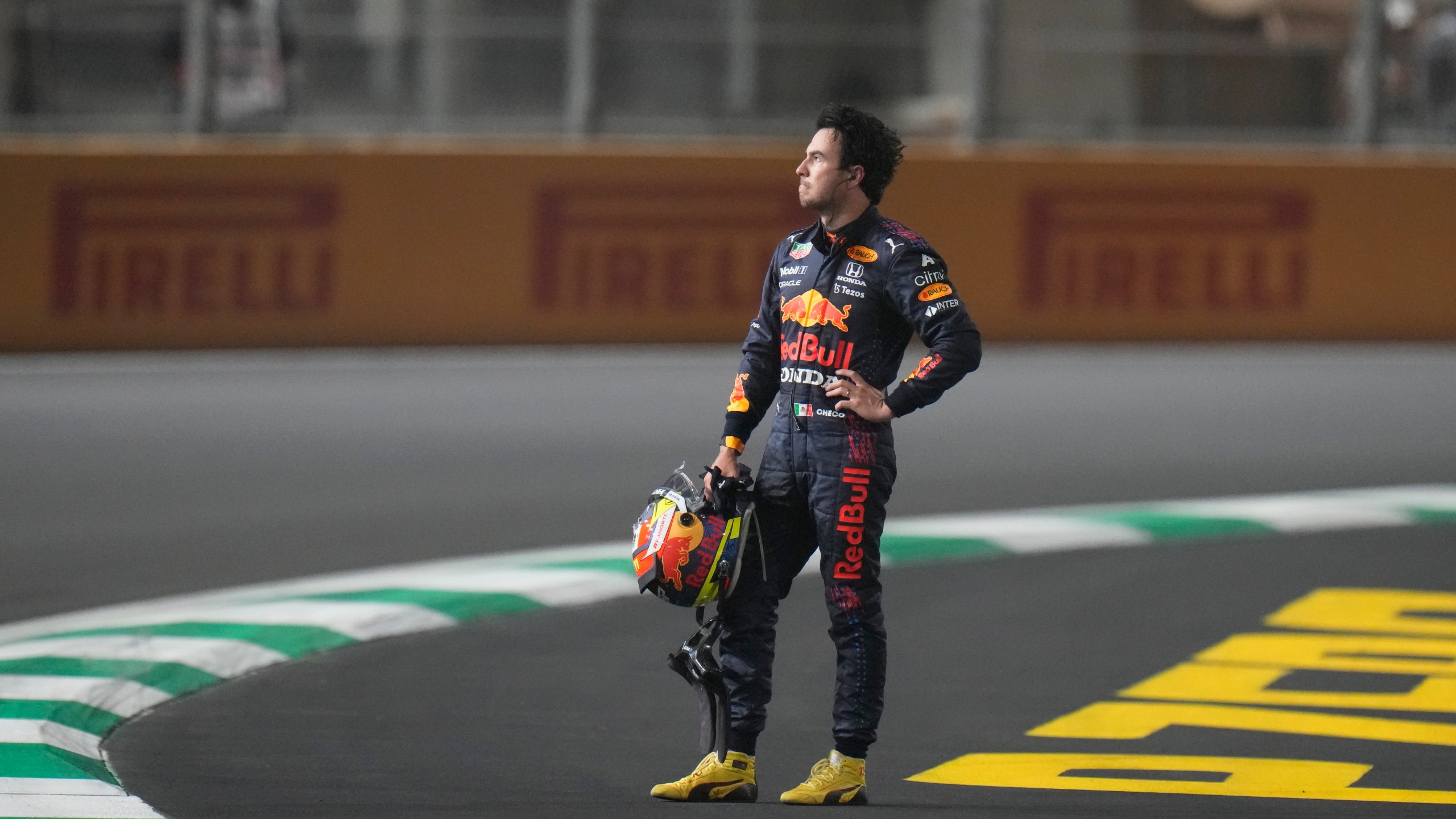 FILE - Red Bull driver Sergio Perez of Mexico waits for the safety car after race was stopped during the Formula One Saudi Arabian Grand Prix in Jiddah, Sunday, Dec. 5, 2021. (AP Photo/Hassan Ammar, File)