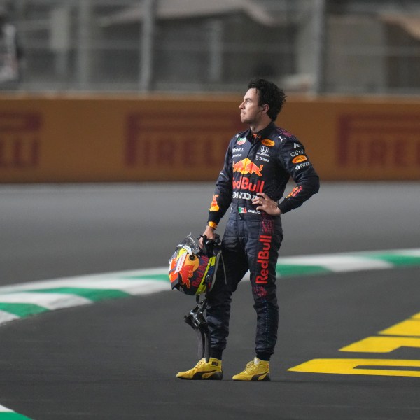 FILE - Red Bull driver Sergio Perez of Mexico waits for the safety car after race was stopped during the Formula One Saudi Arabian Grand Prix in Jiddah, Sunday, Dec. 5, 2021. (AP Photo/Hassan Ammar, File)