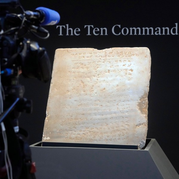 The oldest complete tablet of the Ten Commandments, weighing 115-pounds and approximately 1,500 years old, is displayed at Sotheby's, in New York, Monday, Dec. 9, 2024, where it is to be offered for auction in a single lot sale, Dec, 18, 2024. (AP Photo/Richard Drew)