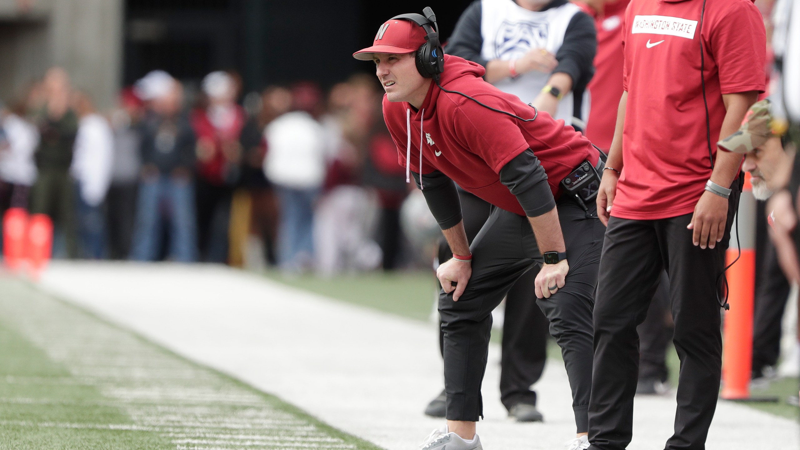 FILE - Washington State head coach Jake Dickert, center, watches the first half of an NCAA college football game, Saturday, Oct. 19, 2024, in Pullman, Wash. (AP Photo/Young Kwak, File)