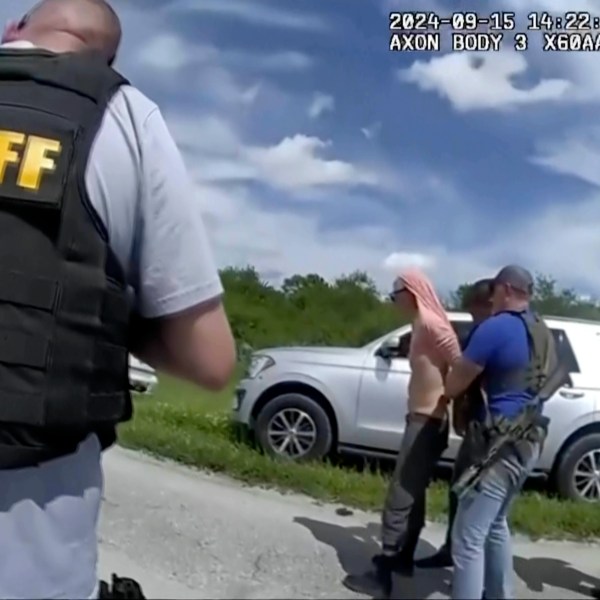 FILE - In this image taken from police body camera video and released by the Martin County, Fla., Sheriff's Office, law enforcement officers arrest Ryan Routh, the man suspected in the apparent assassination attempt of Donald Trump, Sunday, Sept. 15, 2024. (Martin County Sheriff's Office via AP, File)