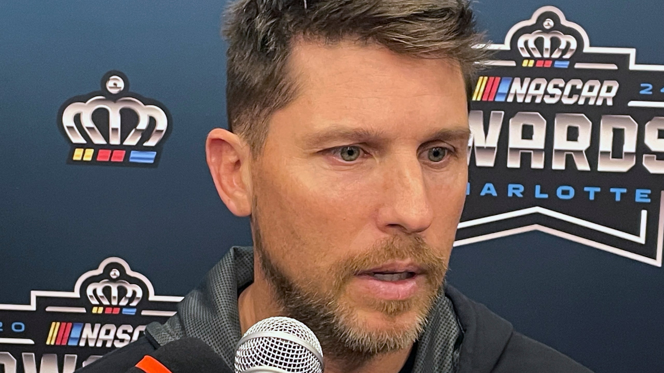 NASCAR auto racing driver Denny Hamlin speaks ahead of the NASCAR awards ceremony in Charlotte N.C., Friday, Nov. 22, 2024. (AP Photo/Steve Reed)