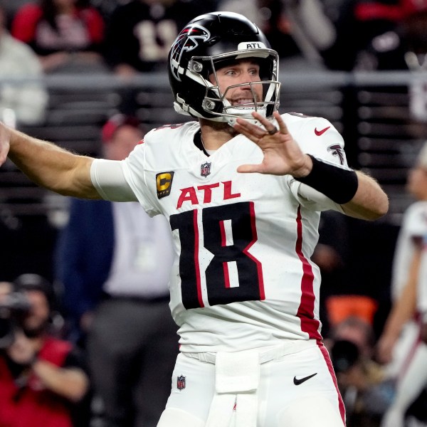 Atlanta Falcons quarterback Kirk Cousins (18) throws against the Las Vegas Raiders during the first half of an NFL football game, Monday, Dec. 16, 2024, in Las Vegas. (AP Photo/Rick Scuteri)