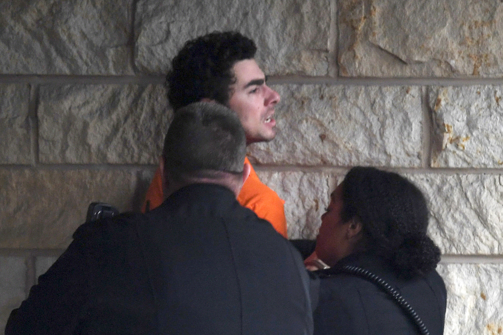 Luigi Nicholas Mangione is escorted into Blair County Courthouse, Tuesday, Dec. 10, 2024, in Hollidaysburg, Pa. (AP Photo/Gary M. Baranec)