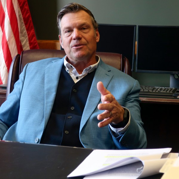 Kansas Attorney General Kris Kobach, who's informally advising President-elect Donald Trump's transition team, discusses immigration issues during an interview with The Associated Press, Wednesday, Dec. 18, 2024, in his office in Topeka, Kan. (AP Photo/John Hanna)