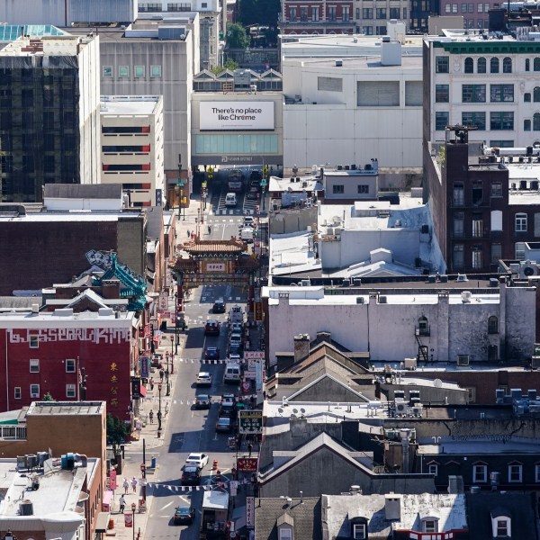 FILE - The Fashion District shopping center, top right, the proposed location of a new Philadelphia 76ers NBA basketball arena, stands near the Chinatown neighborhood in Philadelphia, July 22, 2022. (AP Photo/Matt Rourke, File)