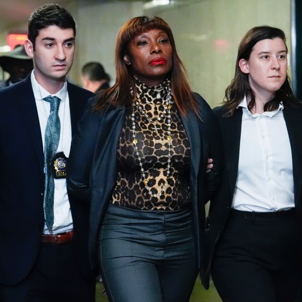 Ingrid Lewis-Martin is escorted into Manhattan criminal court, Thursday, Dec. 19, 2024, in New York. (AP Photo/Julia Demaree Nikhinson)