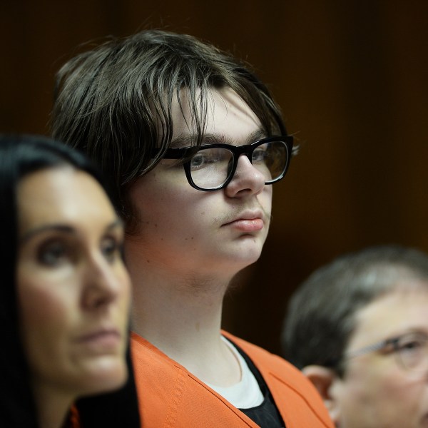 FILE - Ethan Crumbley stands with his attorneys, Paulette Loftin and Amy Hopp, during his hearing at Oakland County Circuit Court, Aug. 1, 2023, in Pontiac, Mich. (Clarence Tabb Jr./Detroit News via AP, Pool)