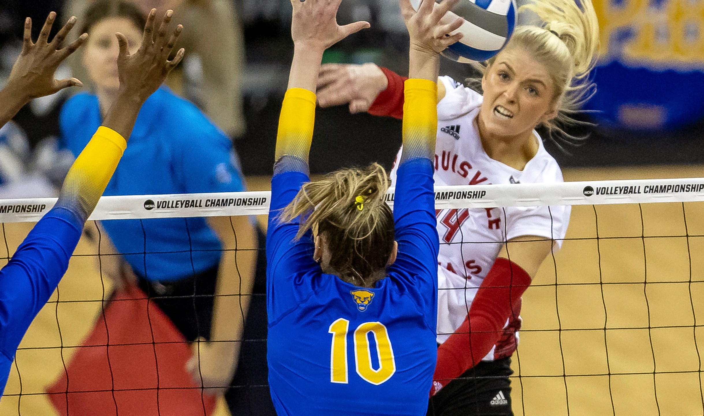 FILE - Louisville's Anna DeBeer, right, spikes the ball against Pittsburgh's Rachel Fairbanks (10) in the third set during the semifinals of the NCAA volleyball tournament Dec. 15, 2022, in Omaha, Neb. (AP Photo/John S. Peterson, File)