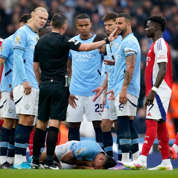 FILE - Manchester City's Rodri lays on the pitch after collision during the English Premier League soccer match between Manchester City and Arsenal at the Etihad stadium in Manchester, England, Sunday, Sept. 22, 2024. (AP Photo/Dave Thompson, File)