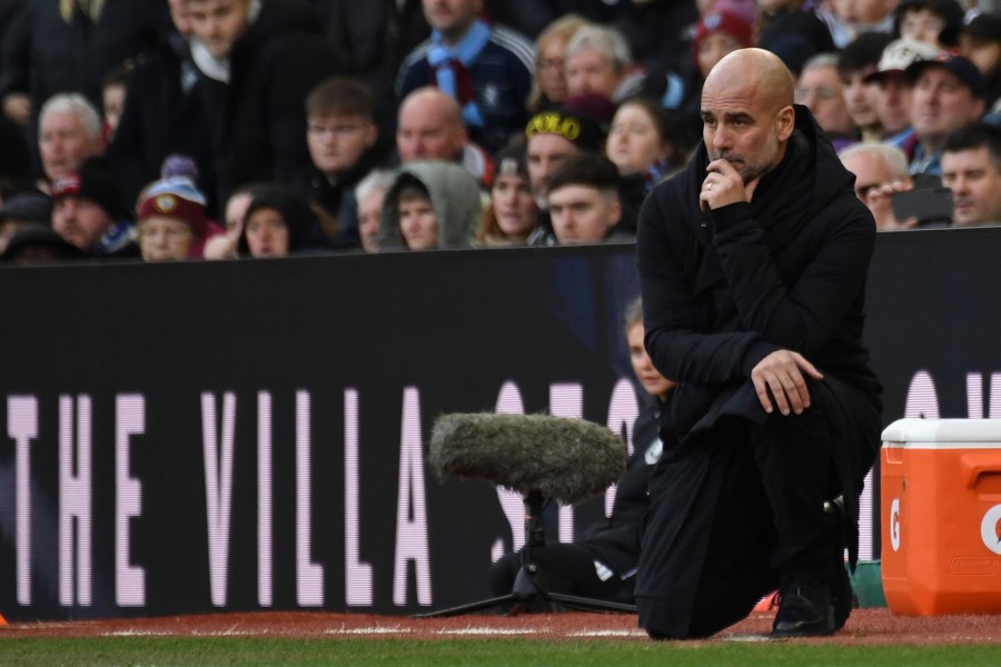 Manchester City's head coach Pep Guardiola reacts during the English Premier League soccer match between Aston Villa and Manchester City, at Villa Park in Birmingham, England, Saturday, Dec. 21, 2024. (AP Photo/Rui Vieira)