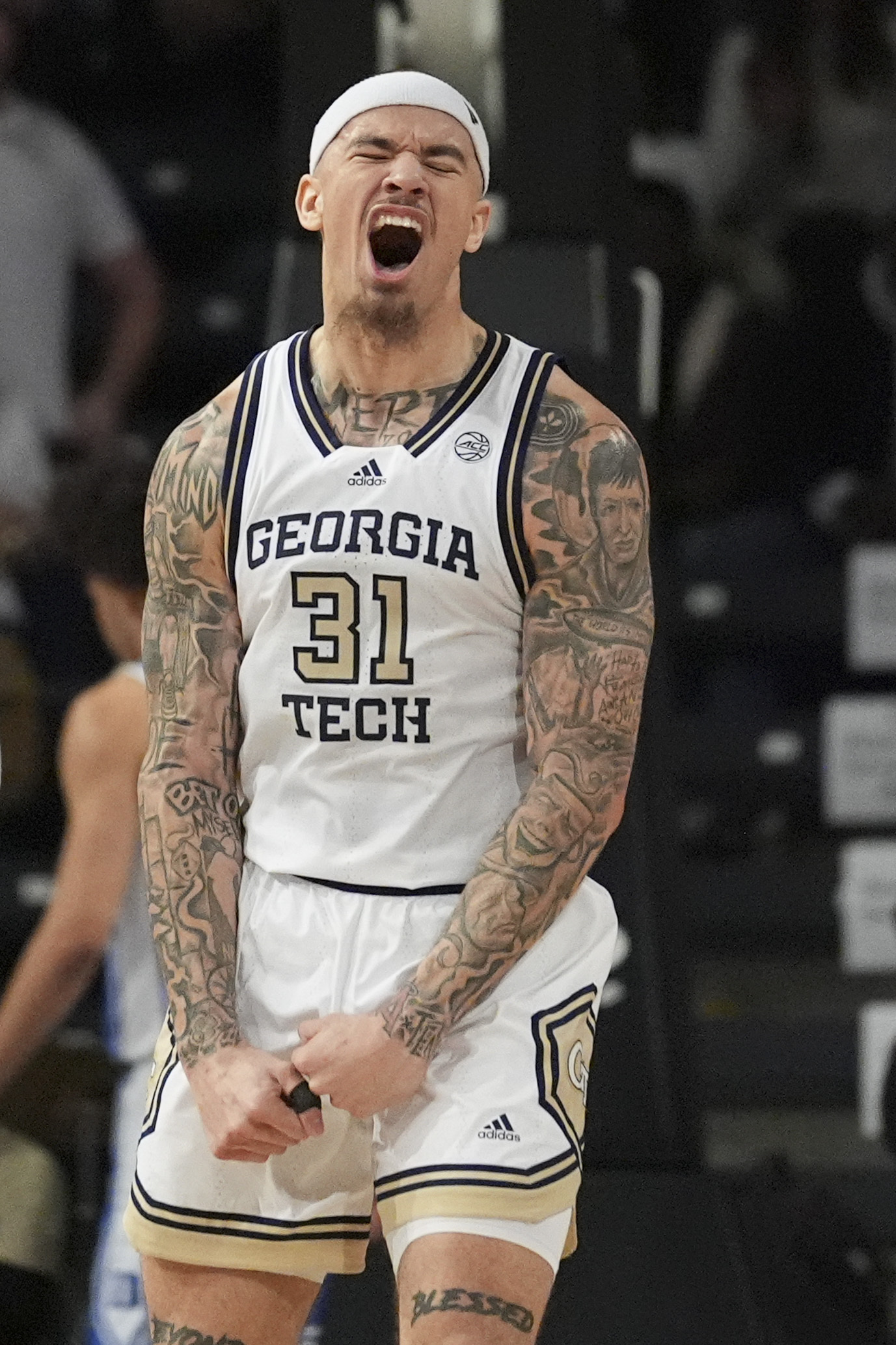 Georgia Tech forward Duncan Powell (31) reacts after a teammate scores during the first half of an NCAA college basketball game against Duke on Saturday, Dec. 21, 2024 in Atlanta. (AP Photo/Brynn Anderson)