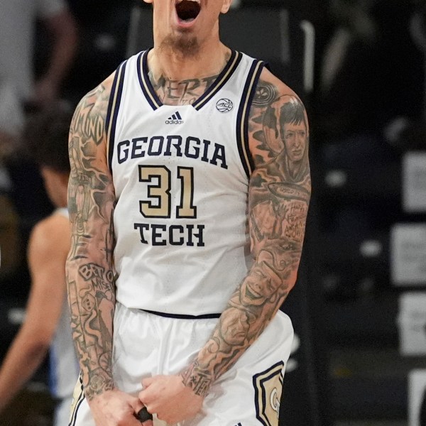 Georgia Tech forward Duncan Powell (31) reacts after a teammate scores during the first half of an NCAA college basketball game against Duke on Saturday, Dec. 21, 2024 in Atlanta. (AP Photo/Brynn Anderson)