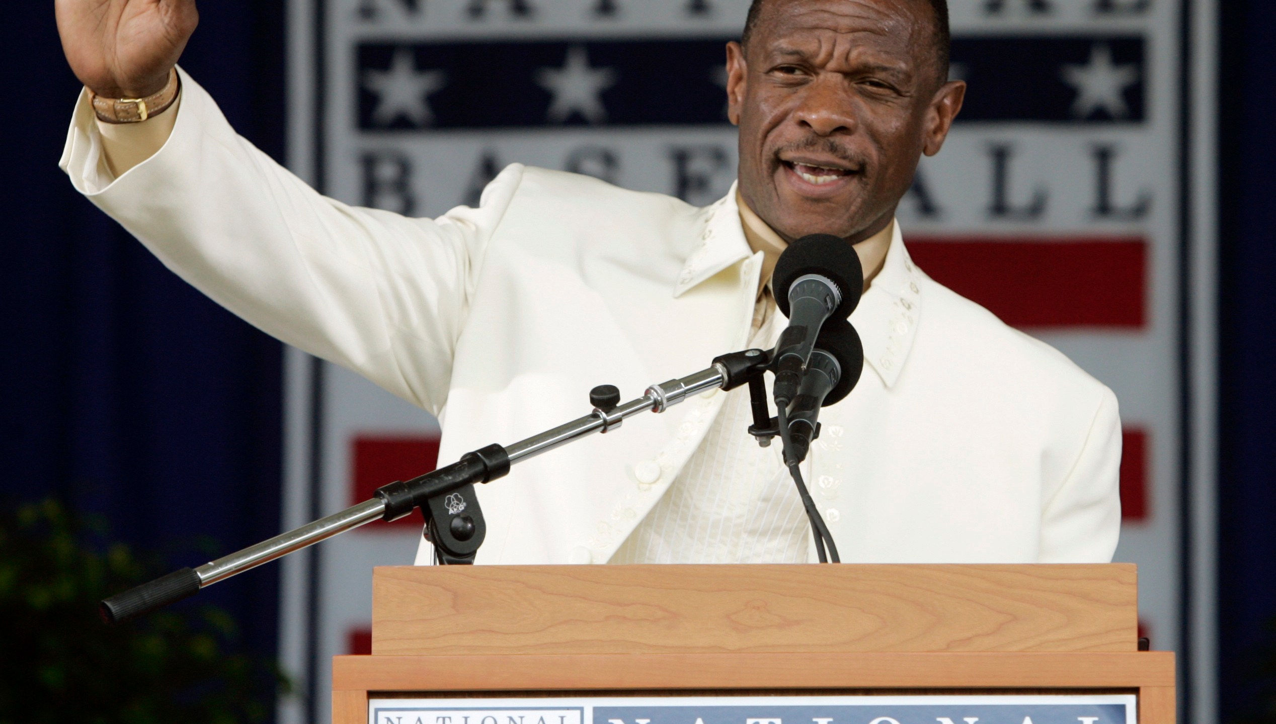 FILE - Rickey Henderson waves to the crowd during his induction speech at the Baseball Hall of Fame in Cooperstown, N.Y., July 26, 2009. (AP Photo/Mike Groll, File)