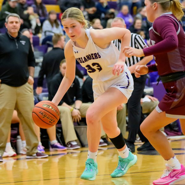 Grand Island High School's Emmy Ward dribbles during a girls high school basketball game against Norfolk High School, Jan. 26, 2024 in Grand Island, Neb. (Jimmy Rash via AP)