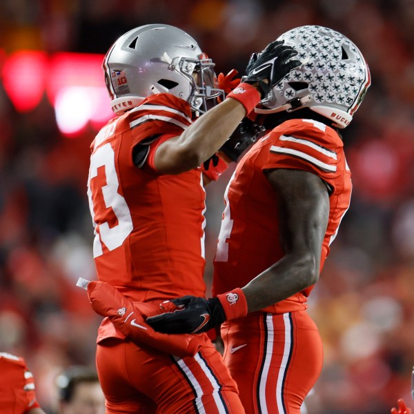 Ohio State receiver Jeremiah Smith, right, celebrates his touchdown against Tennessee with teammate Bryson Rodgers during the first half in the first round of the College Football Playoff, Saturday, Dec. 21, 2024, in Columbus, Ohio. (AP Photo/Jay LaPrete)