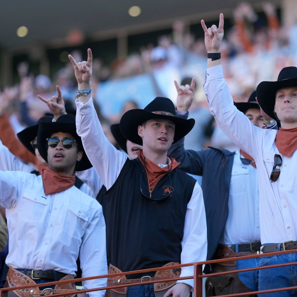 Texas fans cheer during the first half of a first round game against Clemson in the College Football Playoff, Saturday, Dec. 21, 2024, in Austin, Texas. (AP Photo/Eric Gay)