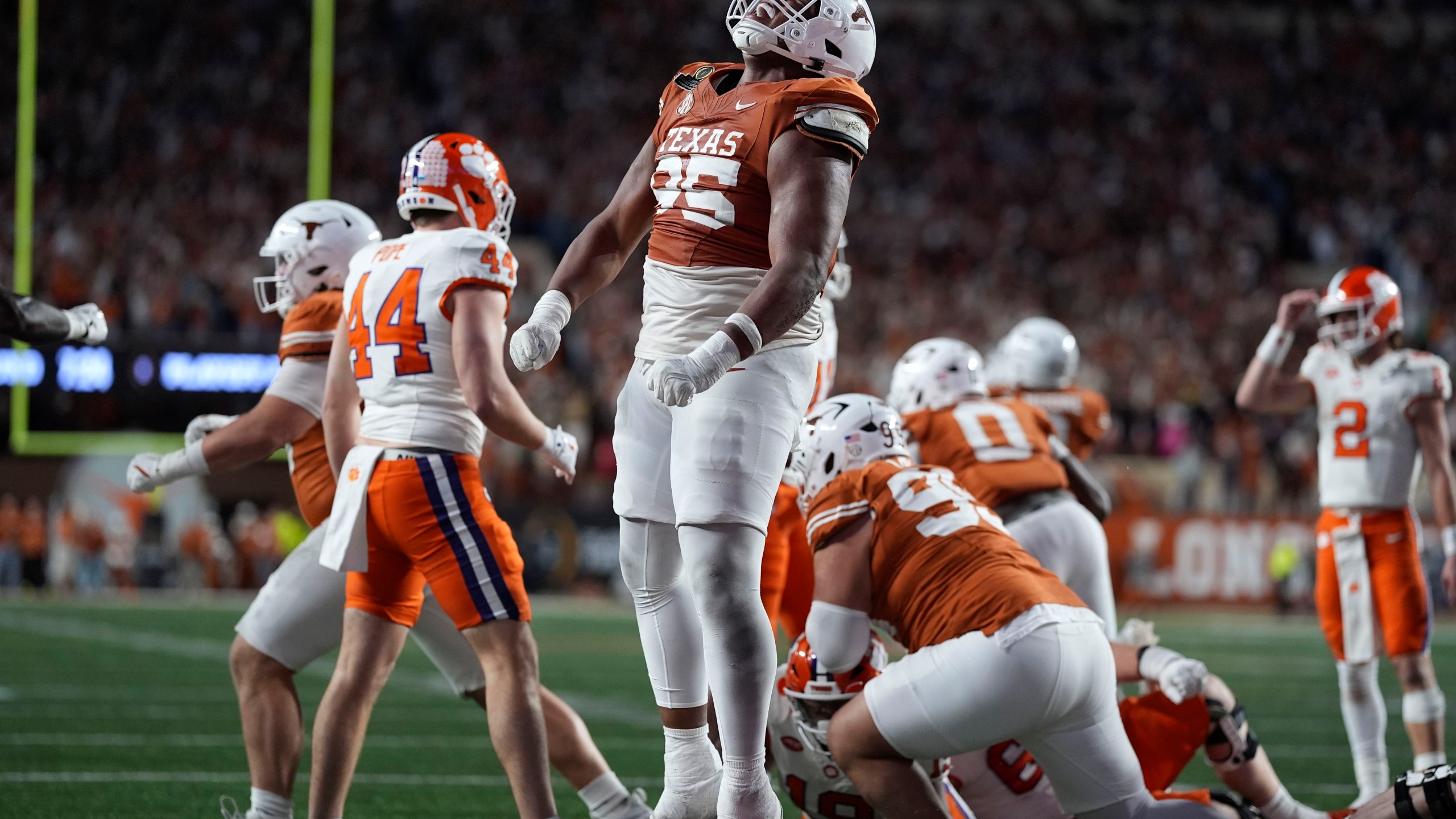 Texas defensive lineman Alfred Collins (95) celebrates after a defensive stop during the second half against Clemson in the first round of the College Football Playoff, Saturday, Dec. 21, 2024, in Austin, Texas. (AP Photo/Eric Gay)