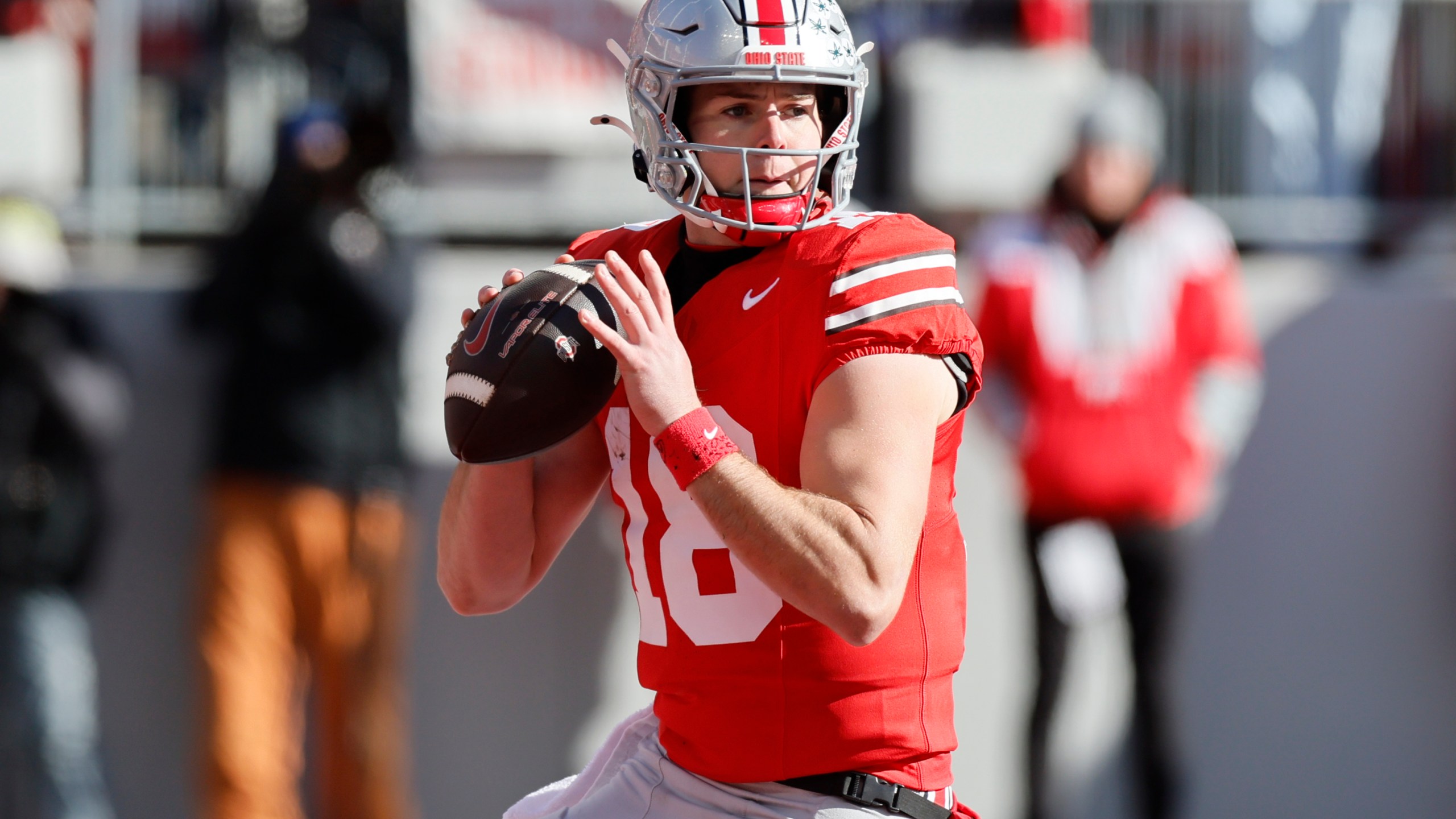 Ohio State quarterback Will Howard looks for an open receiver against Michigan during the first half of an NCAA college football game Saturday, Nov. 30, 2024, in Columbus, Ohio. (AP Photo/Jay LaPrete)